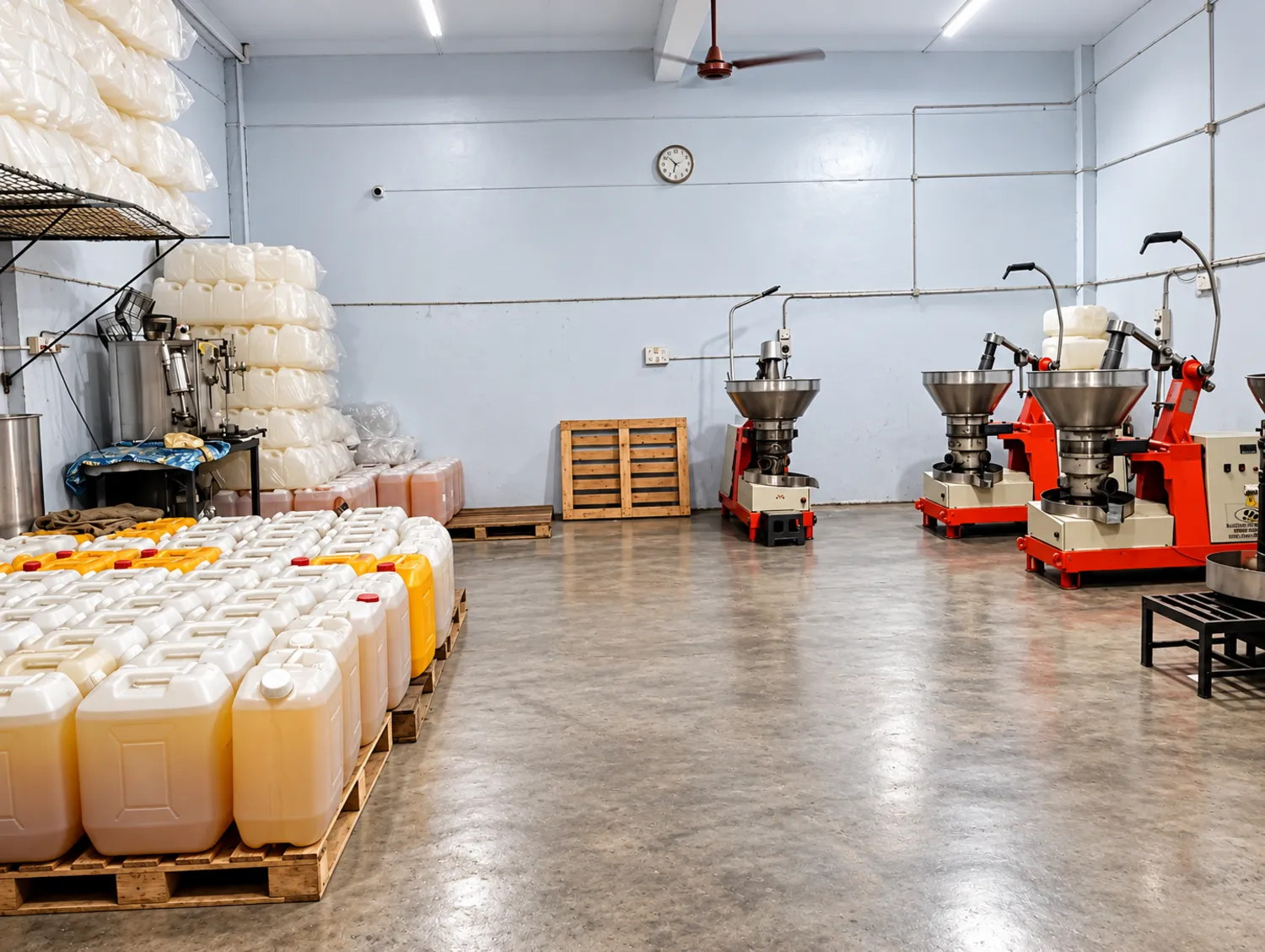 The pressing room with presses and oil cans on pallets